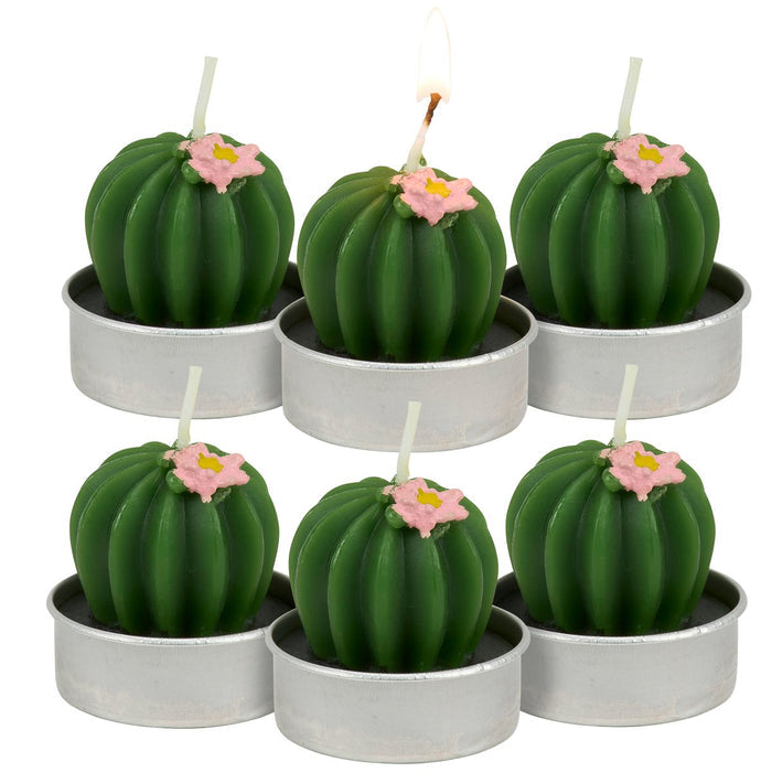 Set of six cactus-shaped candles with pink flowers in small metal pots on a white background