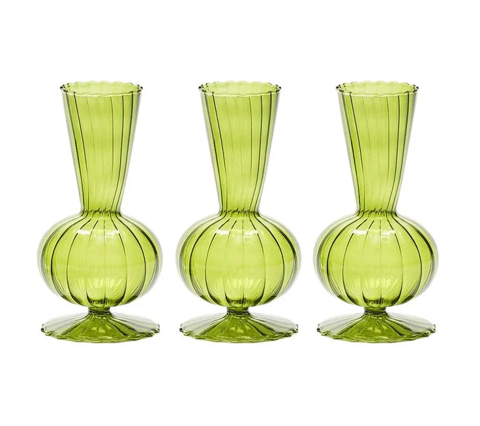 The Kim Seybert Tess Bud Vase Set of 3 in Olive features identical green glass vases with bulbous bases, narrow necks, flared openings, and elegant vertical stripes, arranged in a row against a white background.
