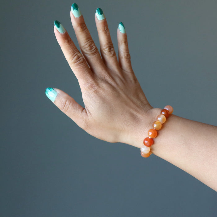 sheila of satin crystals wearing a carnelian bracelet