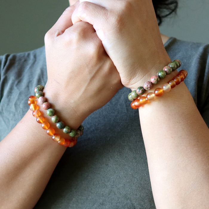 carnelian and unakite bracelet sets on two hands