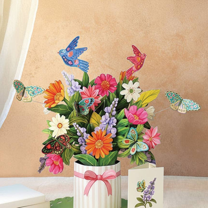 3D floral arrangement with butterflies and a card on a beige background