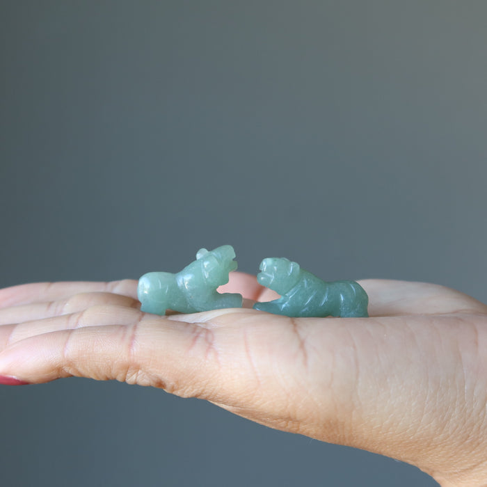 two Green Aventurine Tigers on the model palm