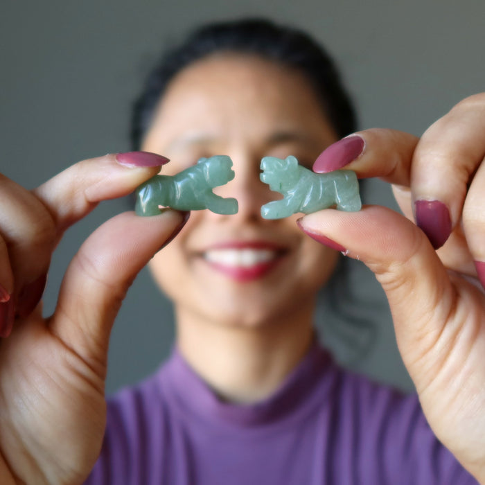 sheila of satin crystals holding Green Aventurine Tigers