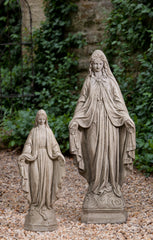 Two Madonnas standing together, one tall and one short with their hands  open