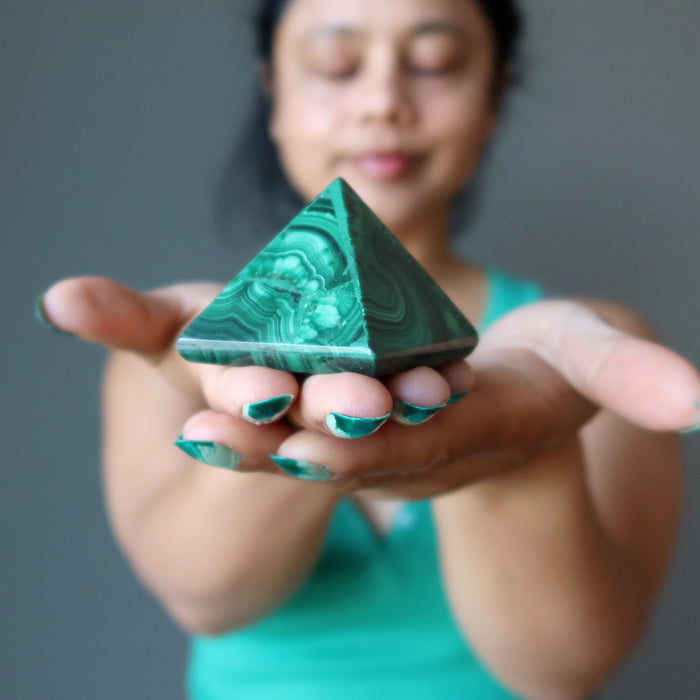 meditating with malachite pyramid