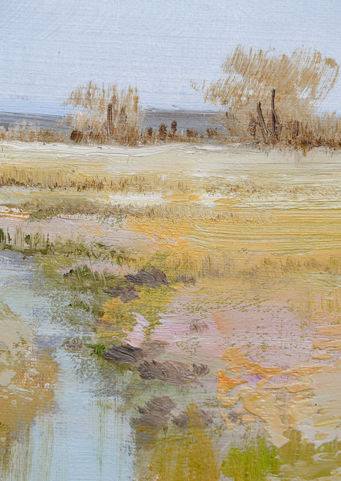 An original oil painting of a colorful meadow with blue stream running through it.