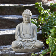 Light gray buddha sitting on steps