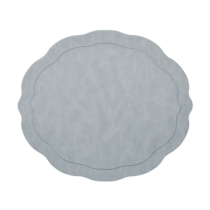 The Kim Seybert Tailored Placemat Set of 4 in Steel Grey features wavy edges, a subtle stitched border, and a smooth texture, shown from above on a white background.