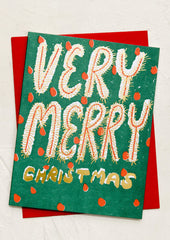 A card in red and green with text reading "Very Merry Christmas".